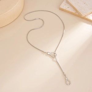 Silver Y-shaped lariat necklace with geometric stirrup-shaped slide buckle detail