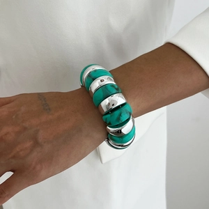 Detail of chunky turquoise textured beads and high-polish silver metal link bracelet