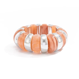Chunky orange resin beads and silver CCB metal segments on a flexible stretch bracelet