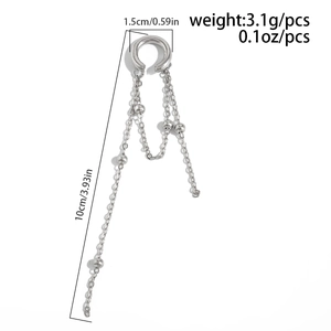 Detail of silver tassel ear cuff showing 1.5cm diameter and 10cm chain length measurements