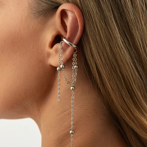 Detail of silver long tassel ear cuff with beads on model for a modern minimalist look