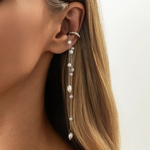 Detailed close-up of a long silver fringe ear cuff featuring delicate white pearls