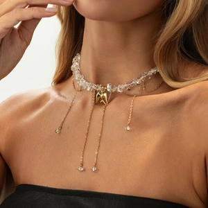 Sexy choker necklace with transparent crystals, gold fringe chains and swallow bird pendant