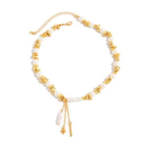 Elegant gold metal and pearl necklace with fringe heart pendant and baroque pearl drop