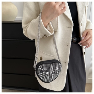 Chic black heart-shaped crossbody bag with sparkling rhinestones and silver chain strap