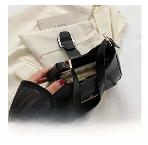 Detailed interior view showing the spacious capacity of the black leather hobo bag
