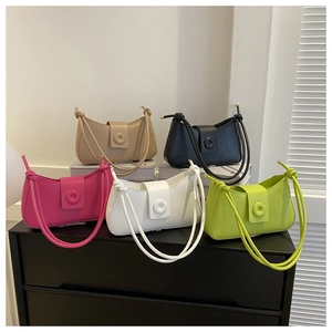 Chic underarm bags in multiple colors featuring decorative buttons and knotted straps
