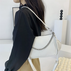 Minimalist white leather crossbody bag with silver chain and detachable small round pouch