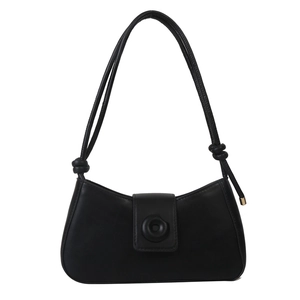 Minimalist black matte leather underarm bag with decorative round buckle and knotted strap