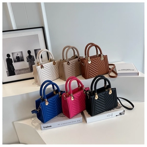 Collection of chevron quilted mini crossbody bags in various colors with woven handles