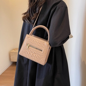 Beige faux crocodile skin handbag with top handle and gold zipper for summer casual style