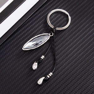 Detail showing high-clarity marquise cut crystal keychain with silver metallic drop charms