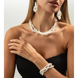 Elegant multi-layer pearl jewelry set including twisted necklace, bracelet and earrings
