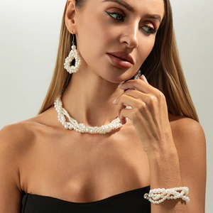 Elegant multi-layer twisted pearl jewelry set with necklace, bracelet, and earrings