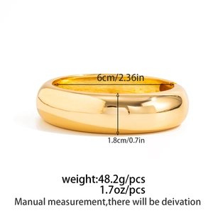 Detailed dimensions of wide gold open bangle showing 6cm inner diameter and 1.8cm width
