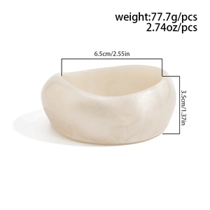 Detail view of cream acrylic bangle with marble texture and dimensions 6.5cm inner diameter