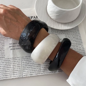 Minimalist wide resin bangles in marble pattern and monochrome styles for modern women