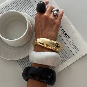 Retro acrylic bangles and chunky rings set with vintage gold and resin marble finish