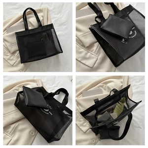 Detail view of large capacity black mesh tote bag set with inner leather pouch and dual handles