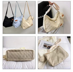 Detail of checkered canvas tote bag featuring matching round coin purse and knit texture