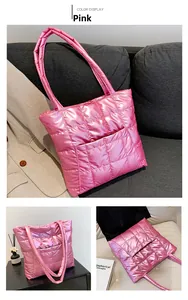 Detail of pink quilted tote bag showing high-gloss metallic nylon and square stitching