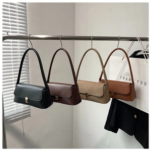 Detailed row of four minimalist faux leather shoulder bags in black, coffee, and khaki