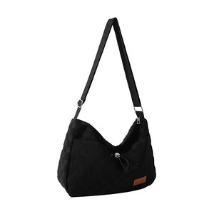 Canvas checkered tote bag with adjustable shoulder strap and drawstring detail
