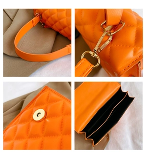 Close-up of orange quilted crossbody bag showing gold hardware and inner compartments