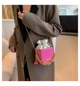 Chic pink pleated mini crossbody bag with gold chunky chain and drawstring detail