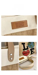 Detailed view of canvas tote bag with leather handles, jute texture, and rivet reinforcements