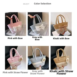 Detail of woven bucket bags with bow and floral accents in pink, grey and khaki