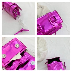 Detail view showing metallic rose red mini bag with acrylic chain and magnetic buckle
