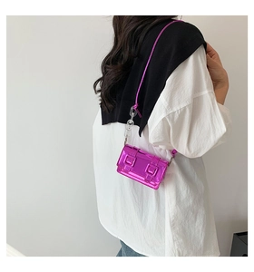 Metallic magenta mini crossbody bag with a chunky transparent chain and double buckles