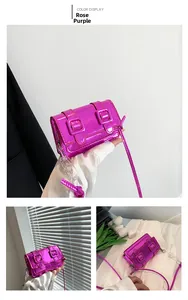 Detail of magenta square bag with dual buckle straps and chunky acrylic chain strap