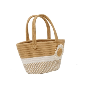 Summer straw shoulder bag with khaki stripes and a decorative sunflower on white background