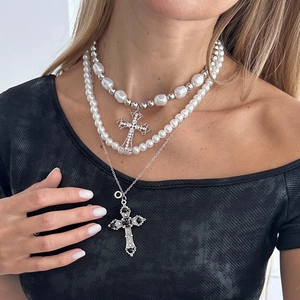 Layered cyberpunk necklace set with silver crosses, black gems, and baroque pearls
