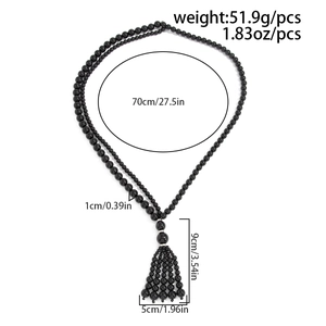 Detailed view of black acrylic beaded long necklace with tassel and dimensions