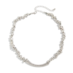 Minimalist silver irregular bead necklace with a curved metal tube pendant and lobster clasp