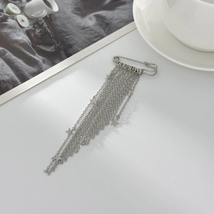 Silver star tassel brooch pin with layered metal chains and star pendants on white background
