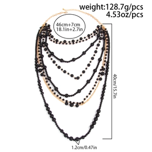 Detailed view of layered black bead necklace with gold chain and size measurements