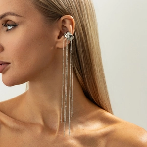 Silver fringe ear cuff with irregular base and long beaded chain tassels on model