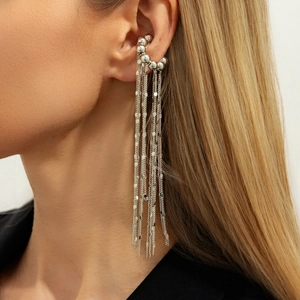 Silver fringe clip-on earrings with long chains and metal sequins shown on model