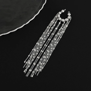 Detailed view of silver tassel ear cuff featuring sleek hanging metal chain layers