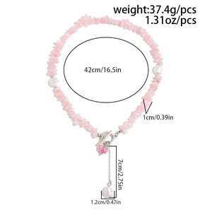 Detailed view of pink crystal beaded necklace with pearl pendant and OT toggle clasp