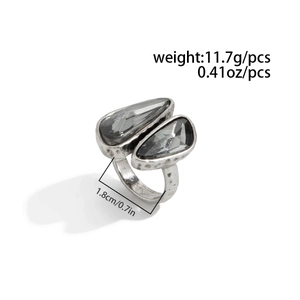 Detail of vintage silver open ring with teardrop grey gemstones and weight dimensions