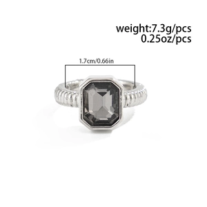 Detailed view of ribbed silver ring with rectangle grey crystal and size measurements