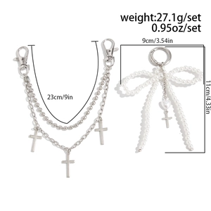 Detail view of multi-layer chain bag charm with cross pendants and pearl bow dimensions