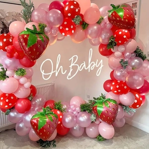 Cute strawberry balloon arch kit with pink and white dots for birthday party decoration