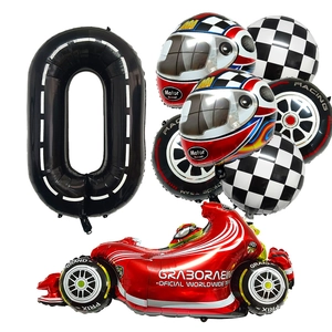 Racing party set detail with red F1 car, checkered flags, helmet and tire balloons