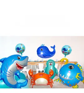 Detail view of ocean animal foil balloons including shark, whale and crab for party decor